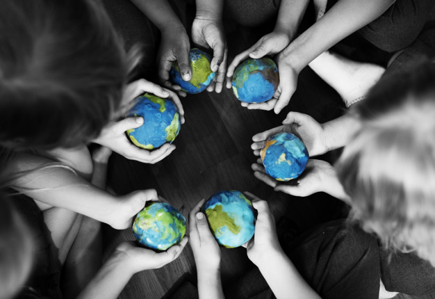Kids holding the world in their hands